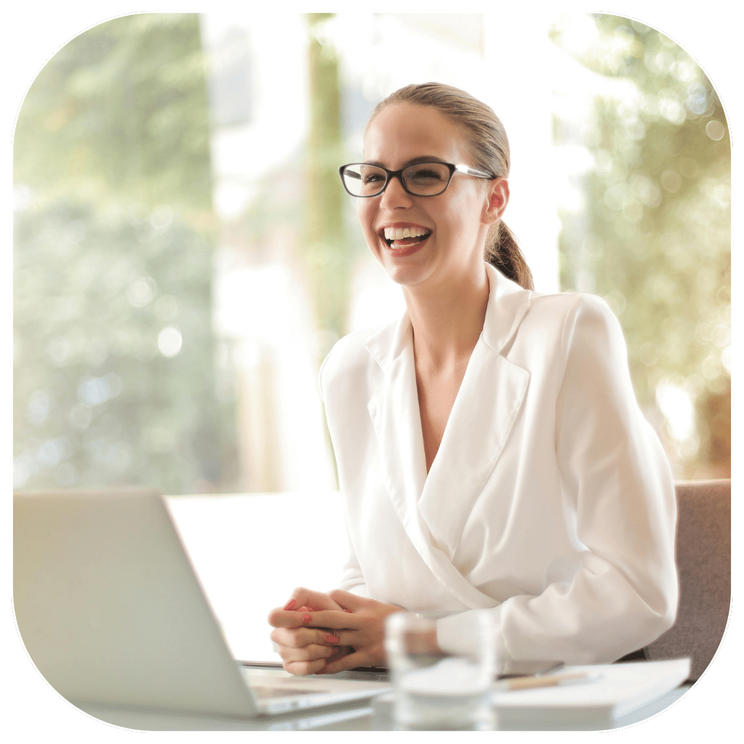 Female online student in front of laptop, practsing her pronunciation.