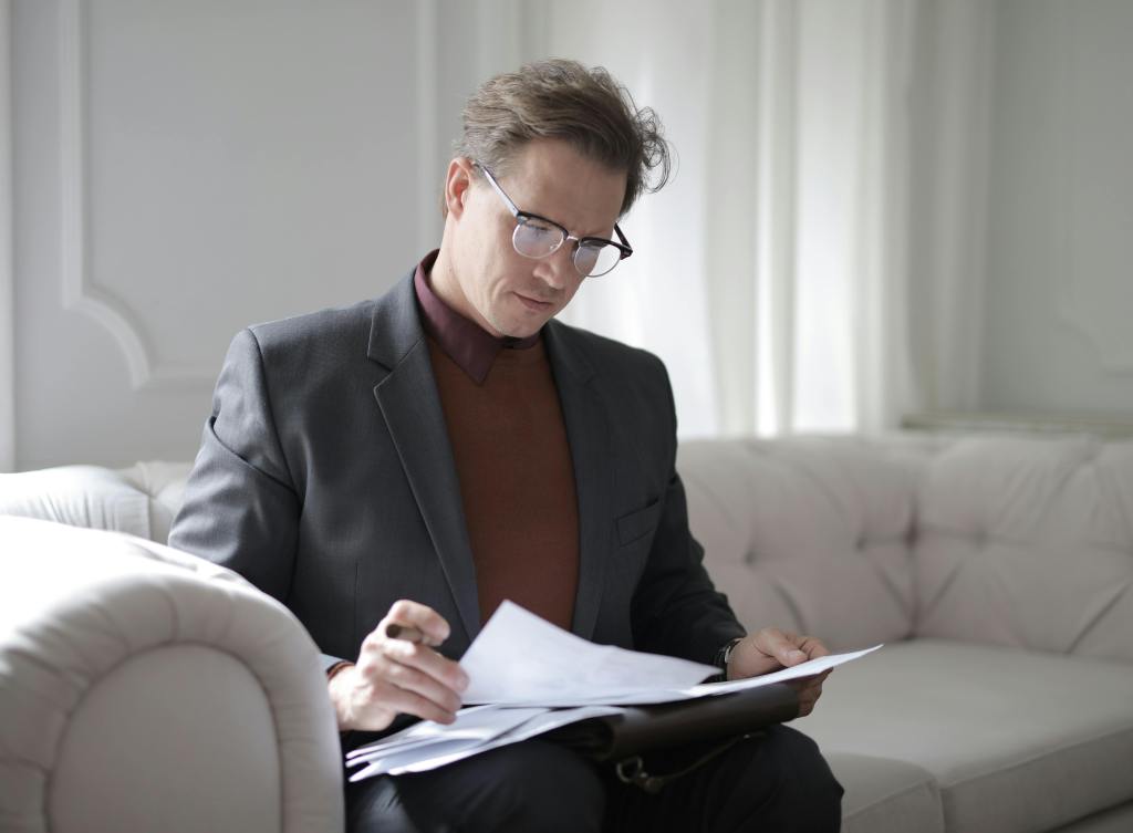 A businessman learning common English expressions for his work to improve his speaking skills.
